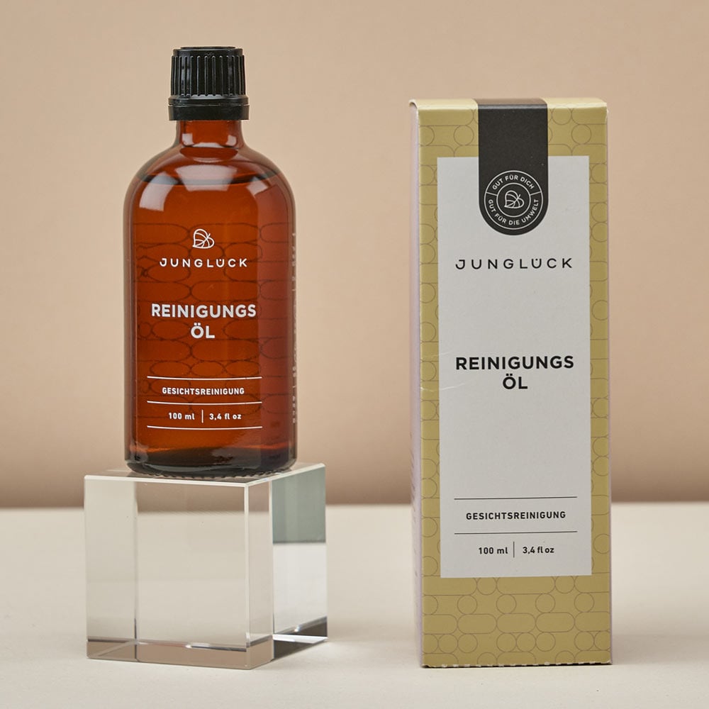 Junglück Reinigingsolie (100 ml) flesje op sokkel naast doosje