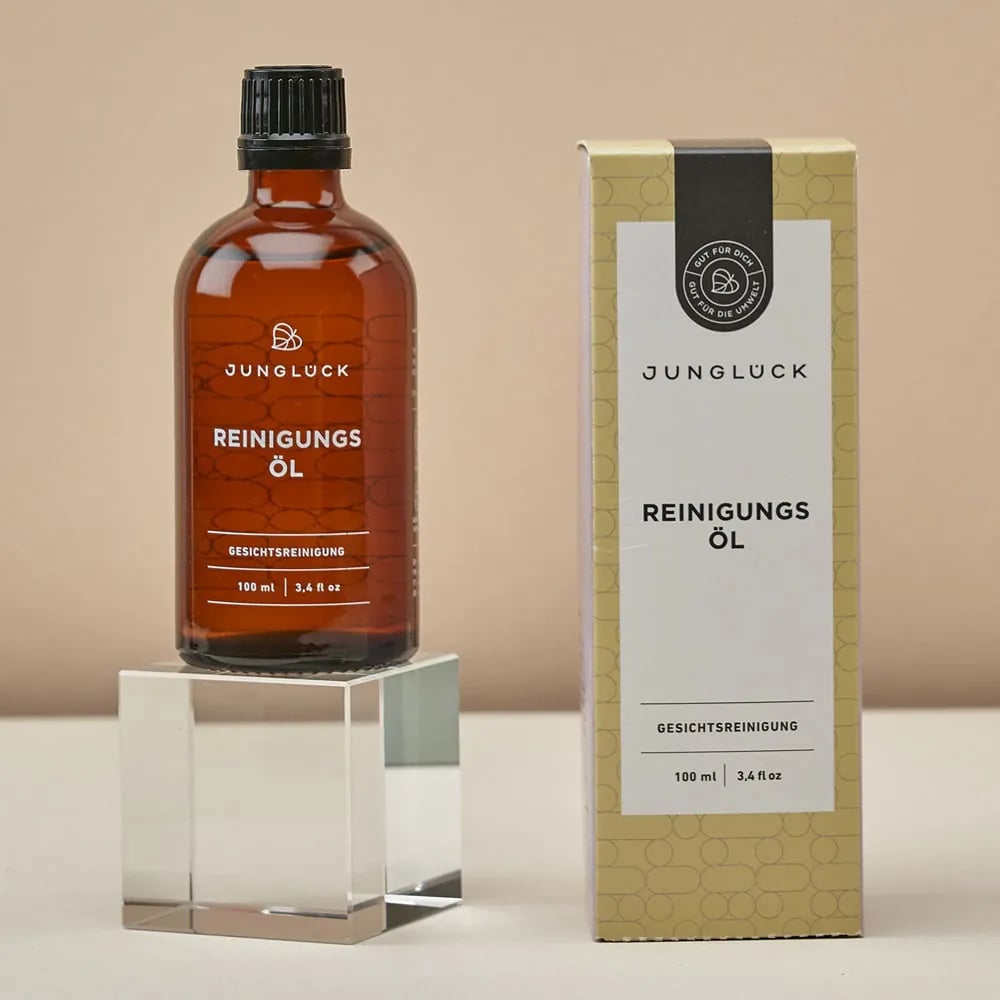 Junglück Reinigingsolie (100 ml) flesje op sokkel naast doosje
